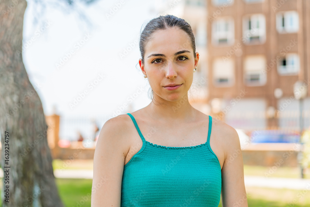 Fototapeta premium Young pretty woman at outdoors . Portrait