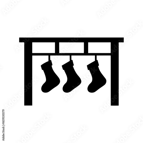 A classic Christmas scene depicting three stockings hanging on the mantelpiece shelf