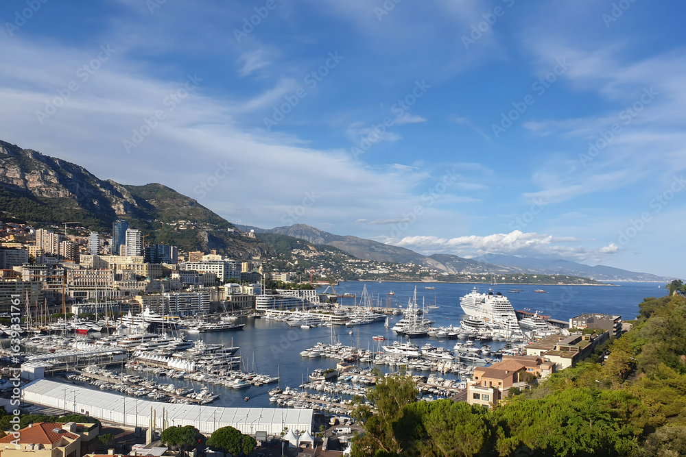 Fototapeta premium Monaco city skyline and Port Hercules marina under blue sky