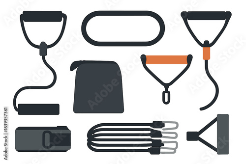 Variety of fitness resistance bands and accessories laid out on a surface for workout preparation at home gym