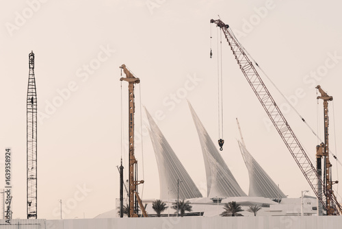 Construction site of Zayed National Museum futuristic building with many cranes at day, Abu Dhabi