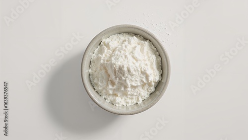 Bird's eye view of milk powder inside a grey bowl