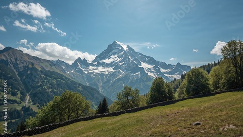 Pristine snow-covered mountain landscape beneath a vivid blue sky