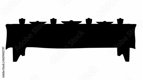 Silhouette of a long table set with plates and glasses covered with a tablecloth in black color