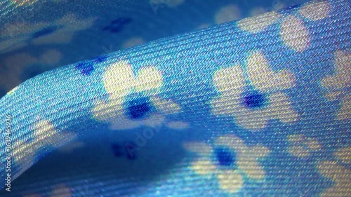 Blue with white flower pattern viscose silk textile material cloth texture blur background macro