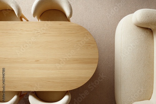 Oval wooden table and cream armchairs