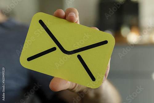 Person holding a yellow car...