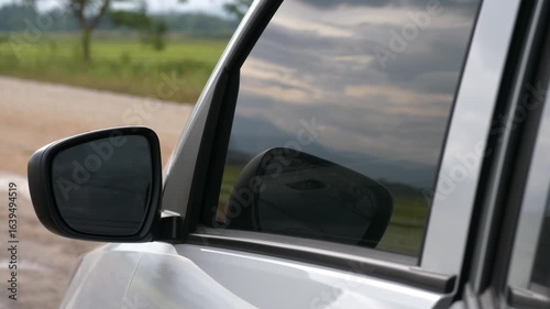 Wallpaper Mural Car Side Mirror Reflecting Cloudy Sky and Countryside Roadside Torontodigital.ca