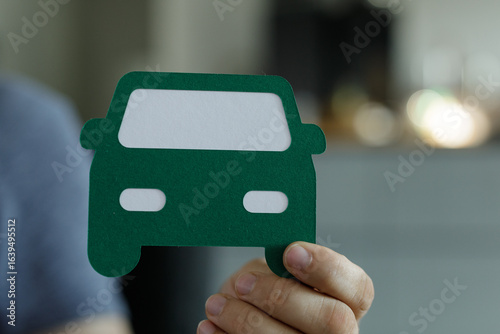 Person holding a green pape...