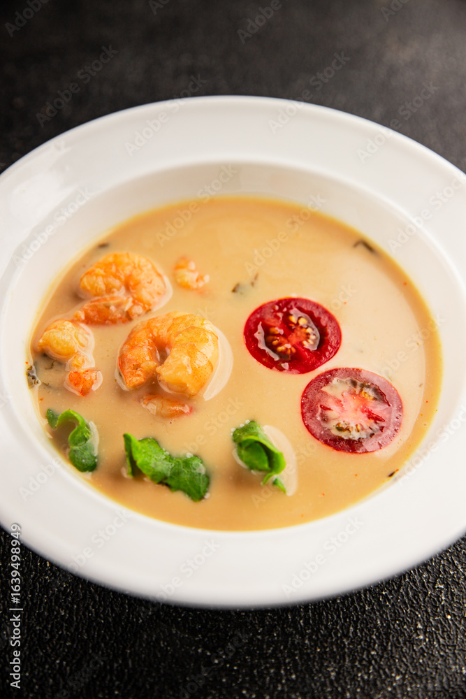 Tom kha soup shrimp, coconut milk, miso paste tasty seafood snack fresh delicious gourmet food background on the table rustic food top view copy space pescetarian diet Tom kha soup shrimp, coconut milk, miso paste tasty seafood snack fresh delicious gourmet food background on the table rustic food top view copy space pescetarian diet