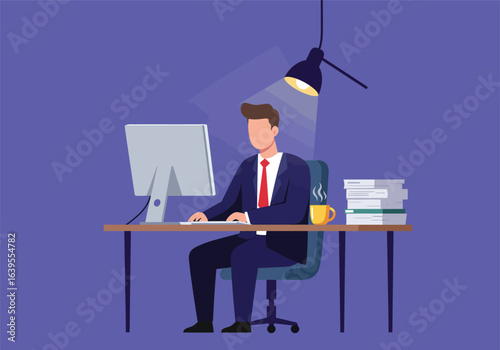 A focused male business builder in a suit working late at night on a computer in a modern office, a concept of dedication and productivity.