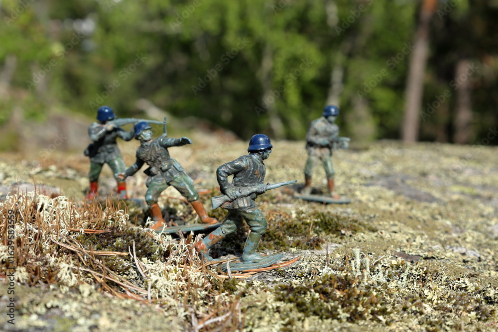 Obraz premium German WW2 toy soldiers. Playing outside in nature. Close up and isolated, blurred background.