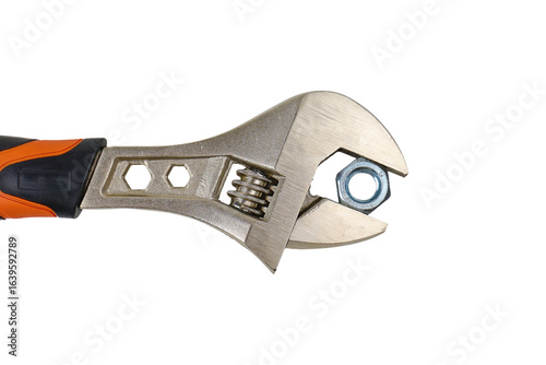 Adjustable wrench held with a metal nut on a transparent background