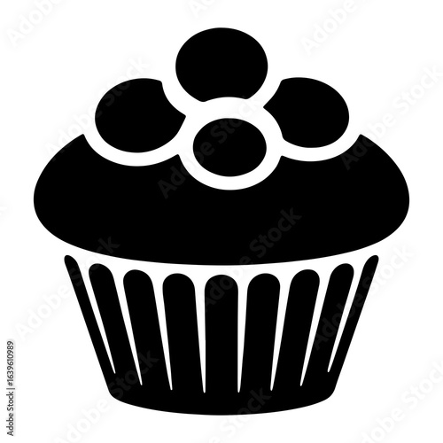 Black cupcake with round toppings dessert sweet
