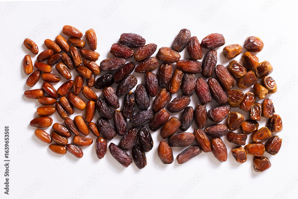 Obraz premium Assorted Varieties of Dates on White Background