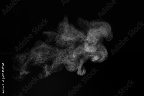 Blur white water vapour on isolated black background. Abstract of steam with copy space. Steam flow. Smoke on white background.