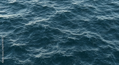 A detailed overhead view of dark blue ocean waves