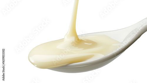 Wallpaper Mural Condensed milk flowing down from a metal spoon isolated on a transparent background Torontodigital.ca