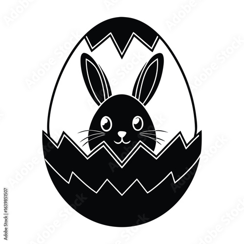 Black bunny emerging from cracked egg rabbit easter egg
