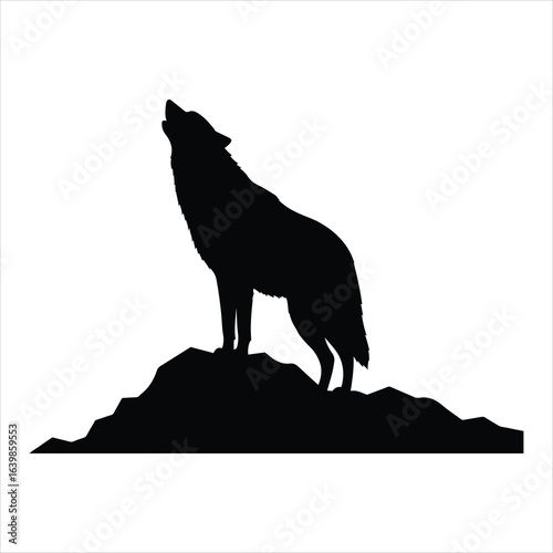 Majestic wolf howling at the moon on a rocky outcrop silhouette