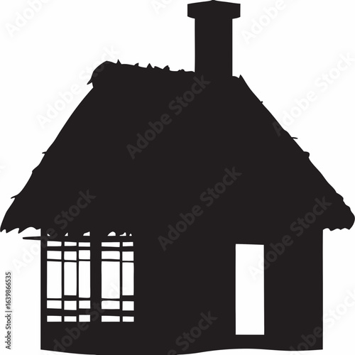 Silhouette of thatched cottage with chimney