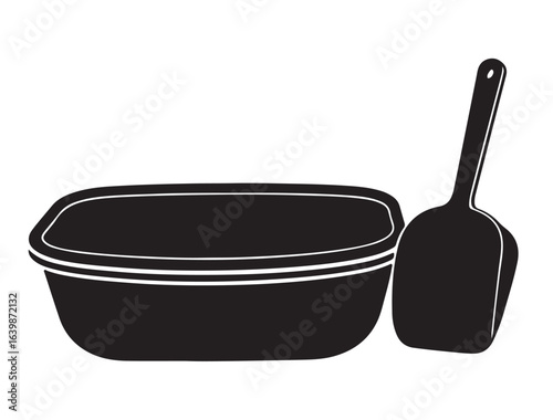 Cat litter box with scoop beside it 