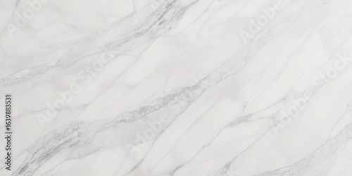 Luxury texture of light gray marble with flowing natural patterns and faint metallic highlights.	