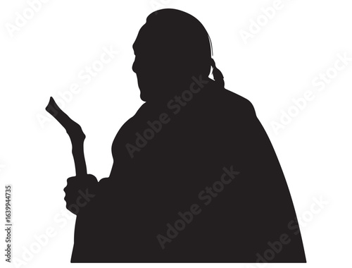 Silhouette of an Indigenous Elder Holding a Staff – Symbol of wisdom, traditio