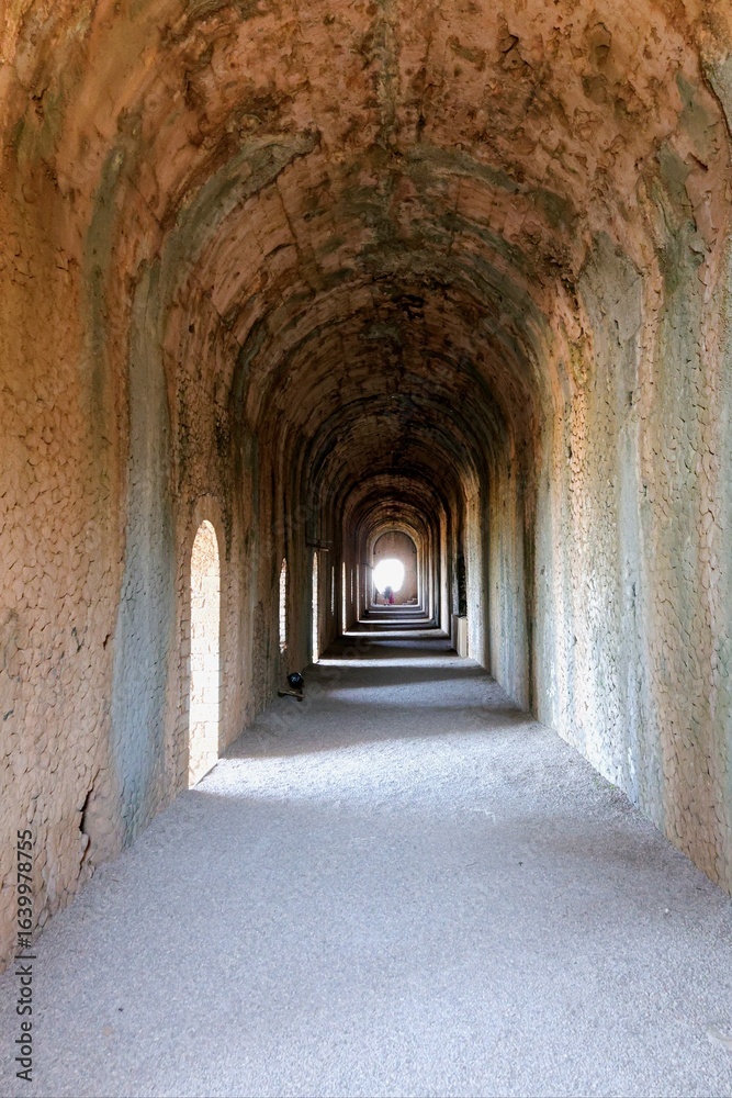 Fototapeta premium Perspective of the famous vaulted tunnel at the Sanctuary of Jupiter Anxur, a Roman temple in Terracina, Italy