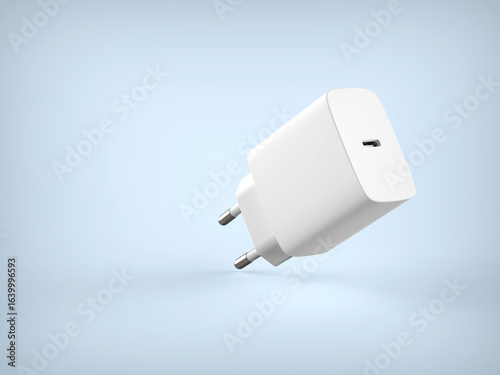 White mobile phone charger on a light blue background