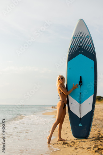 Woman enjoying the sunset a...