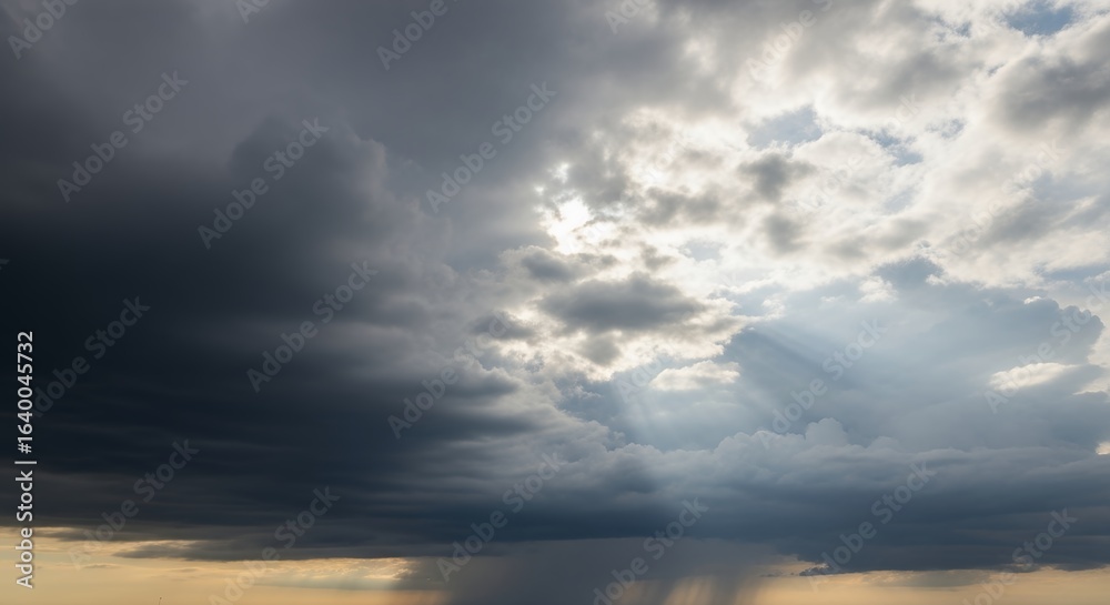 Obraz premium Dramatic Sky with Sunbeams Breaking Through Storm Clouds Weather Landscape Photography for Nature Backgrounds and Atmospheric Art