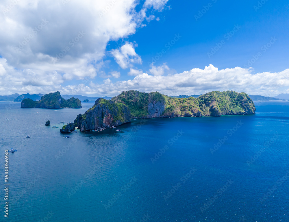 Fototapeta premium Island hopping at El Nido, Palawan, Philippines archipelago. Tour A, B, C, D with traditional Filipino boats. Aerial drone view