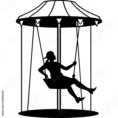 Silhouette of a girl enjoying a swing ride at an amusement park
