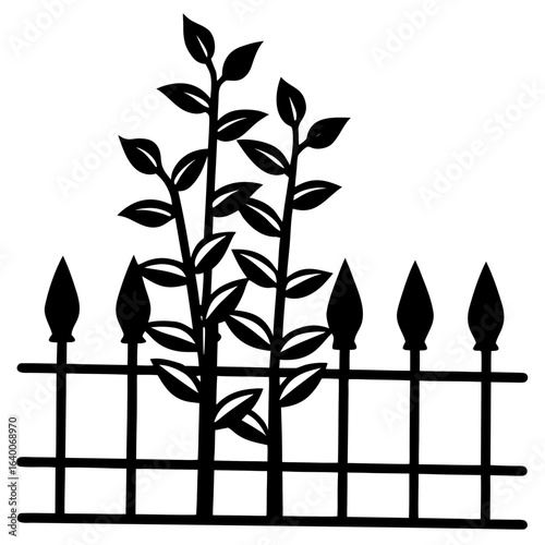 Black silhouette of plants growing through a spiked fence
