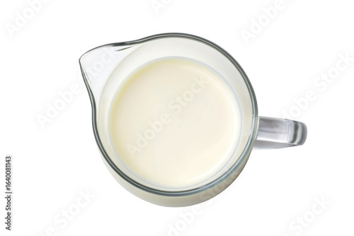 Glass creamer filled with white liquid isolated on transparent background