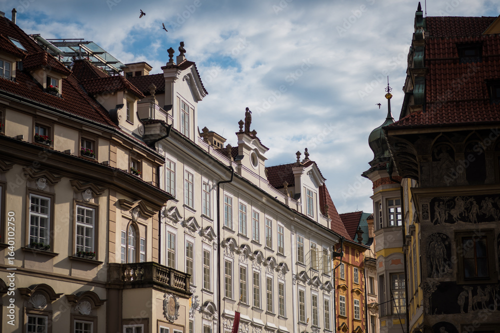 Obraz premium old town hall, historic buildings, likely in Prague's Old Town. The buildings feature classic European architecture, with ornate facades and detailed stonework