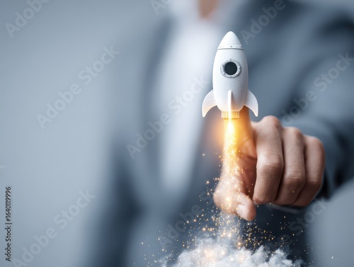 Business start up. A businessman's touch rocket launch investment growth, planning, and corporate business start up with the goal of achieving leadership in value development and a target client base.