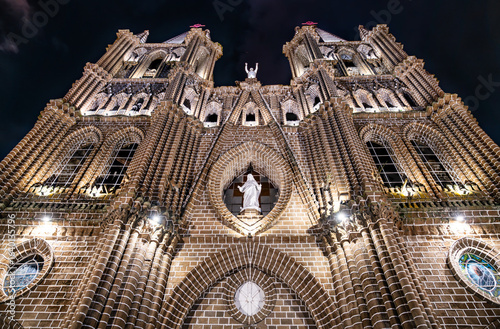 Photography Low-angle night view of Jardin's brick Basilica of the Immaculate Conception, it