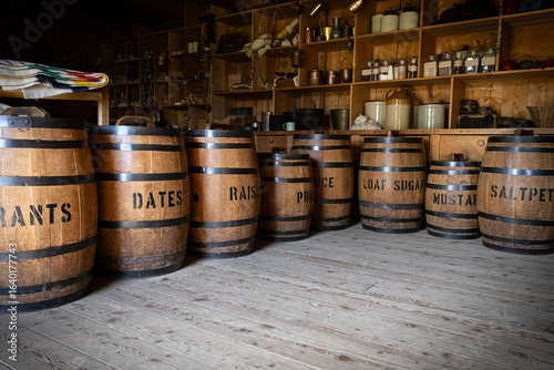 Fotografi Wooden Storage Barrels in Historic General Store
