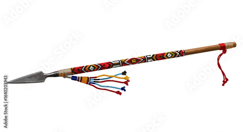 Beaded African spear with sharp metal point on white background.