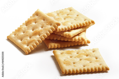Saltine style Crackers pile on white background