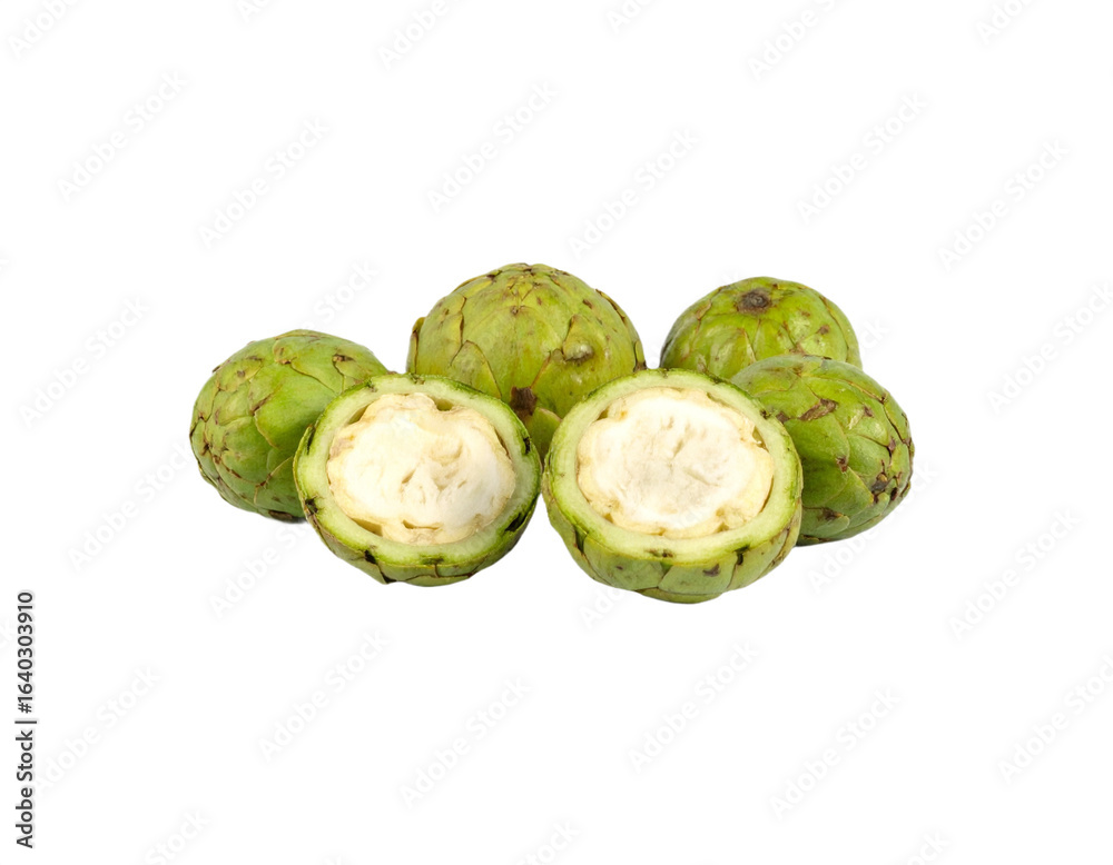 Obraz premium Fresh custard apples, one perfectly halved, showcasing creamy white flesh and seeds, ready for healthy eating.
