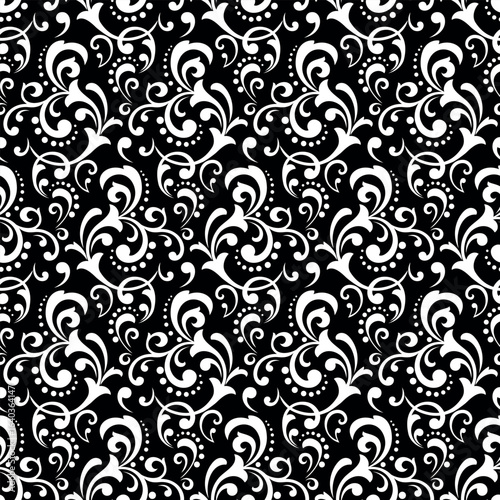 Wallpaper in the style of Baroque. Seamless vector background. White and black floral ornament. Graphic pattern for fabric, wallpaper, packaging. Ornate Damask flower ornament.