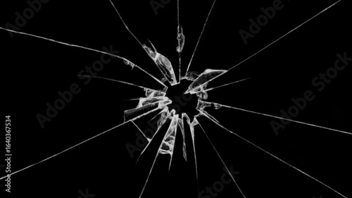 Realistic glass breakage on black background.