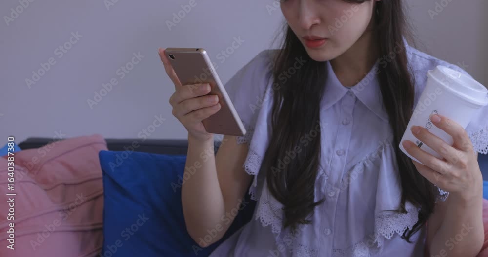 Body parts of Japanese woman online shopping by card and smartphone in the living