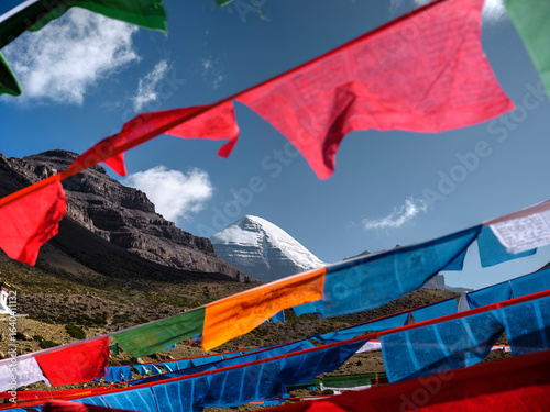 mount kailash under blue sky with tibetan prayer flags and blue sky, tibet, china
