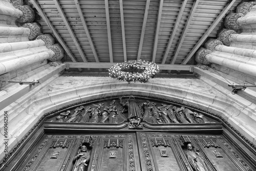 NYC Ornate Cathedral Door with Religious Sculptures in black and white