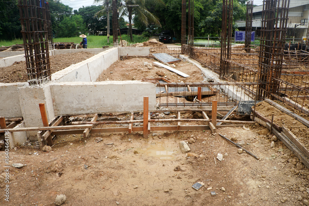 Cement casting of ground beams of only half their total length as the connecting part between each foundation. Cement casting of ground beams of only half their total length as the connecting part between each foundation.