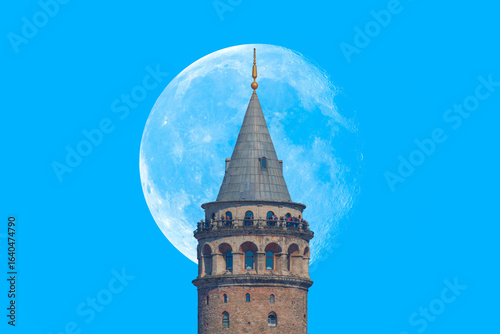 Fototapeta Naklejka Na Ścianę i Meble -  Galata Tower with bright blue sky with full moon - istanbul, Turkey 